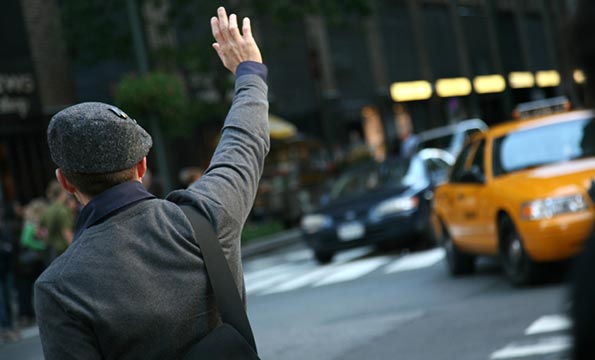 Man Hails Yellow Taxi Cab