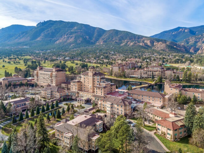 The Broadmoor Campus in Colorado. Mountains are in the background
