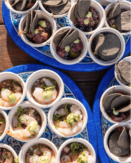 An arrangement of small dishes of shrimp and chips from Rancho La Puerta