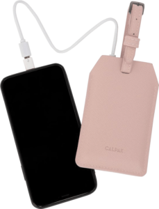 A pink luggage tag that is also a power bank plugged into an iPhone