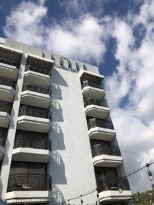 The exterior of The London West Hollywood. A white building with balconies on every floor