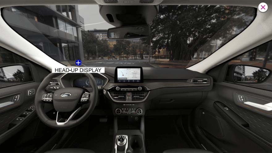 A simulated car interior, with a button labeled "Heads-Up Display"