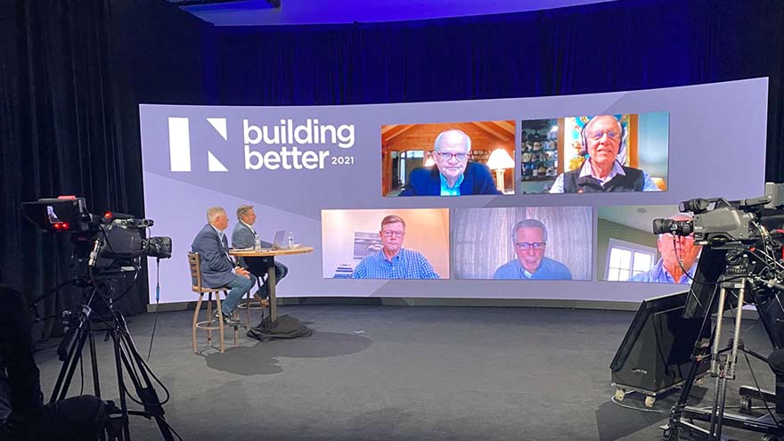 A hybrid event panel of seven men, text on the screen reading "Build Better 2021"