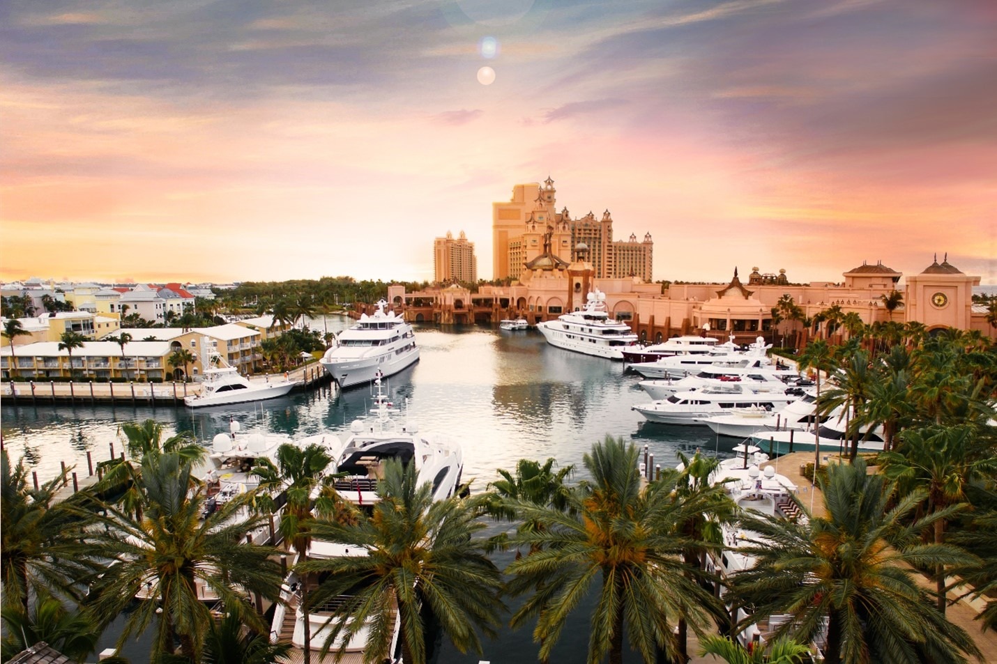 Atlantis Paradise Island in the Bahamas will be renovated for the next few years. The pink resort sits behind a marina and palm trees.