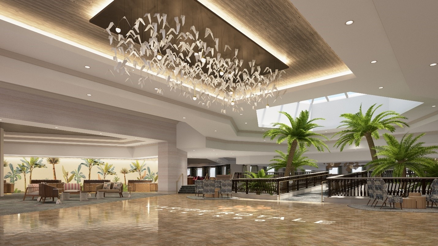 The new hotel lobby at Caribe Royale Orlando. An open tiled space has paper birds suspended from the ceiling and palm trees around a walkway.