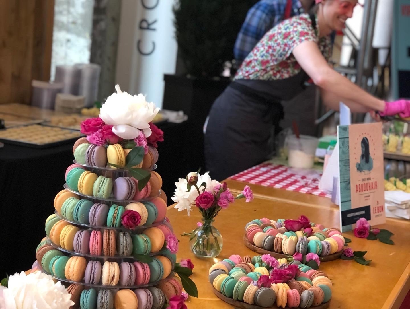 A tall display of colorful macaroons at the Le Bon Apetit fundraiser.