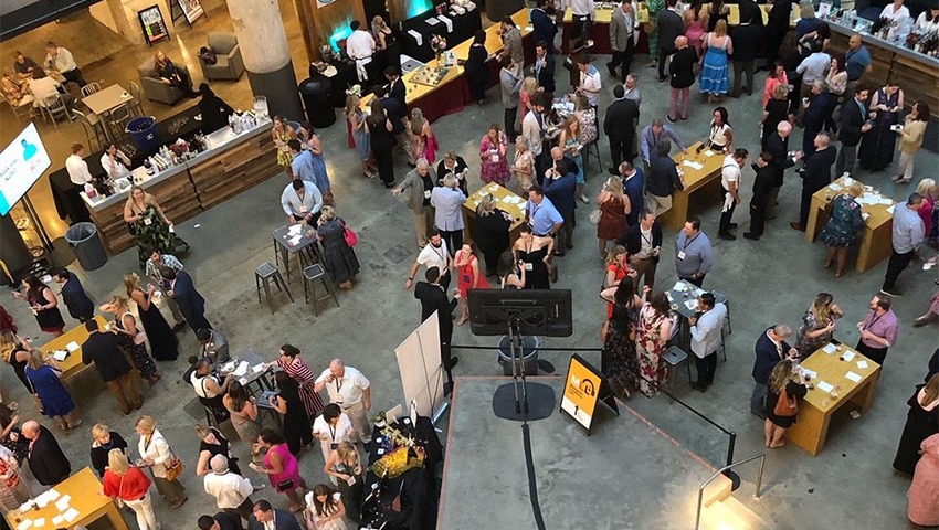 An overhead shot of people at the Le Bon Appetit fundraiser.