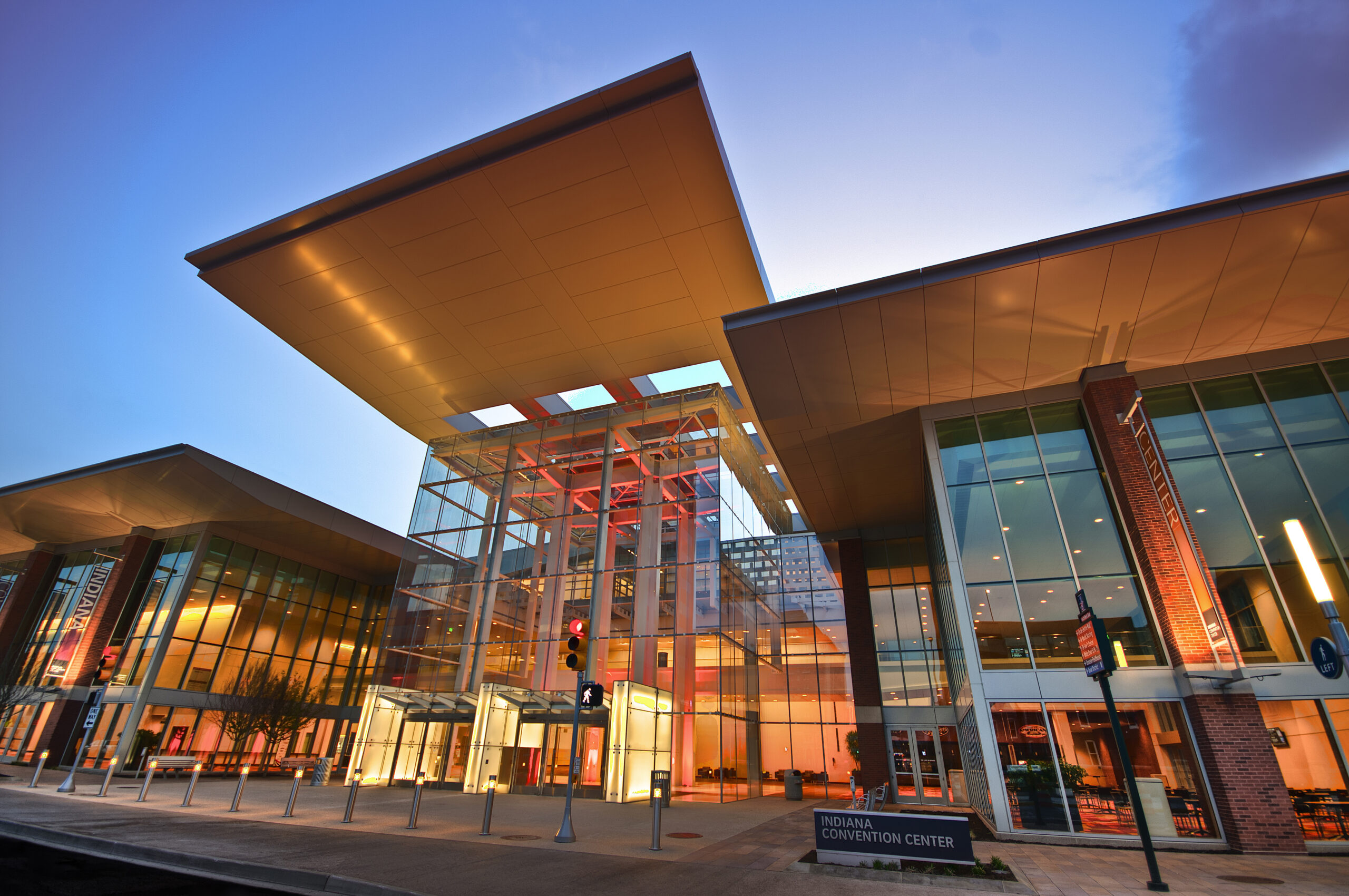 The exterior of the Indiana Convention Center lit up orange