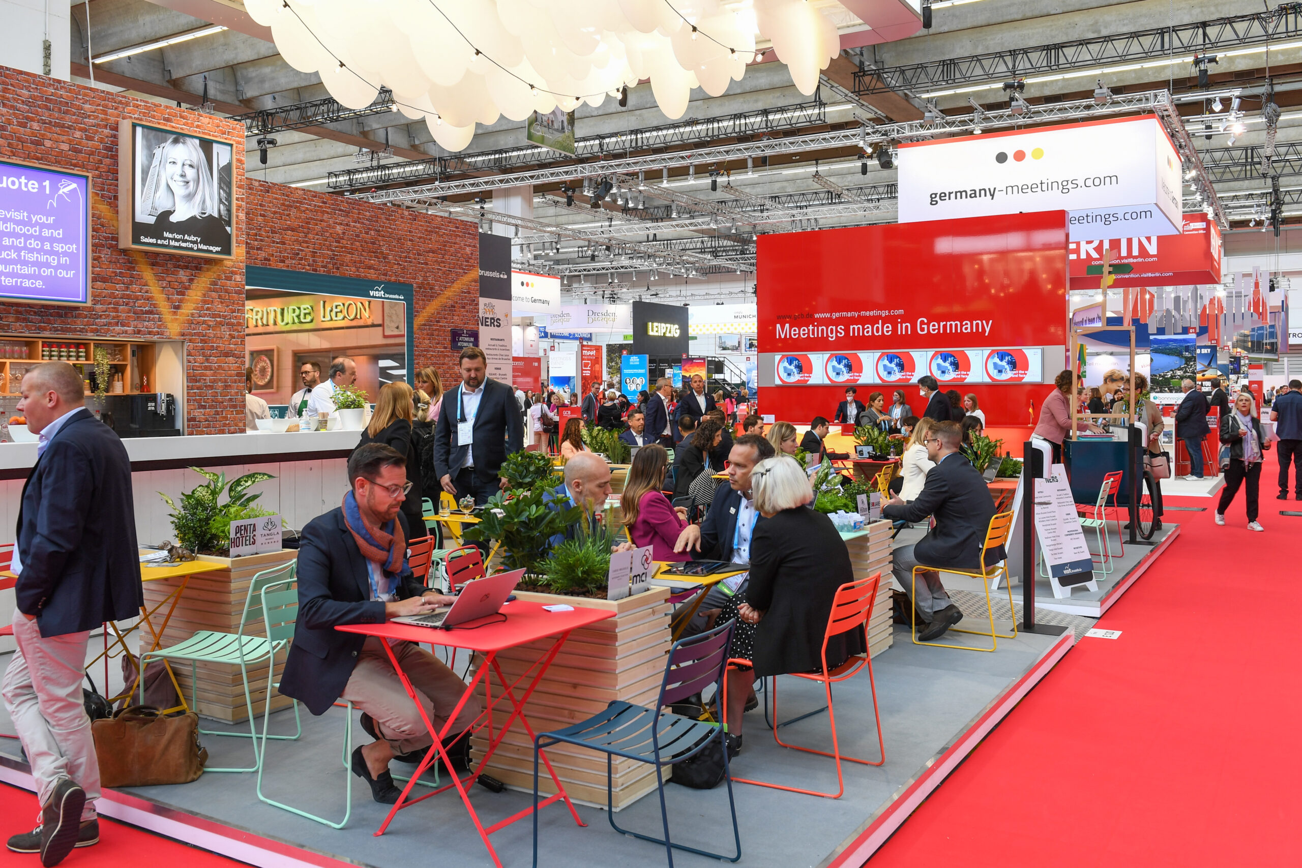 small groups of businesspeople sitting and talking at imex frankfurt