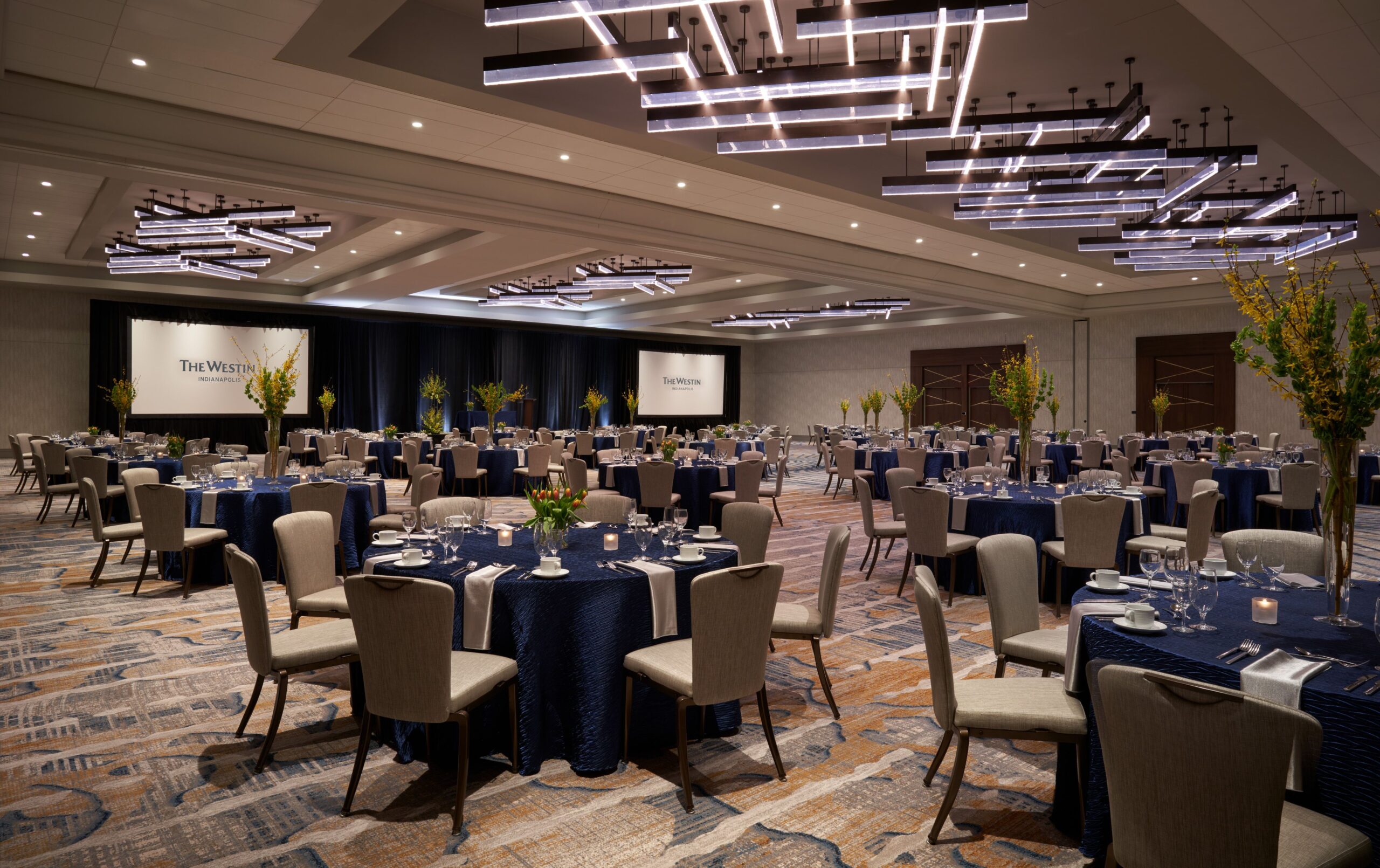A renovated ballroom at The Westin Indianapolis, decorated in dark blues and neutrals