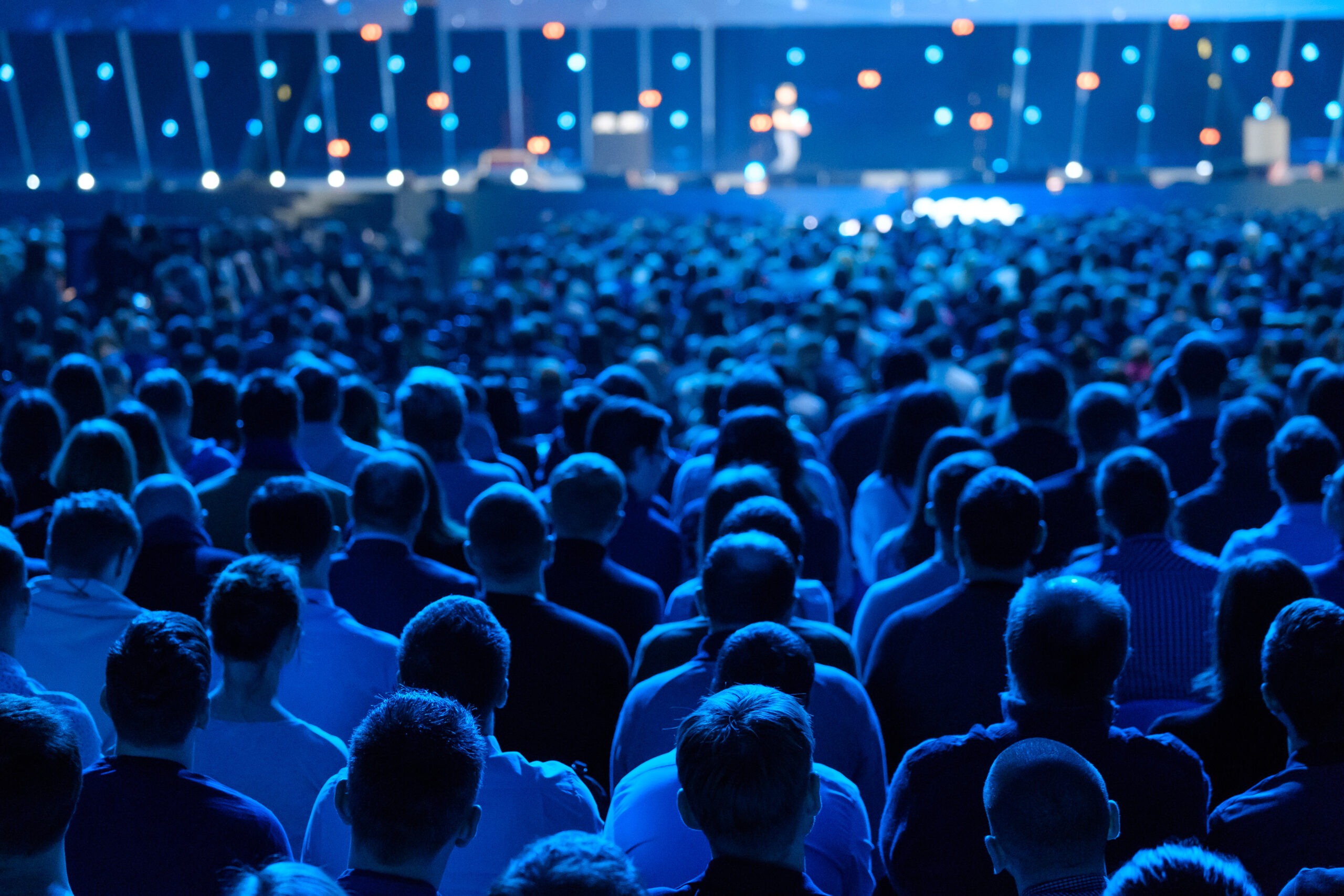 Image of crowd under blue light