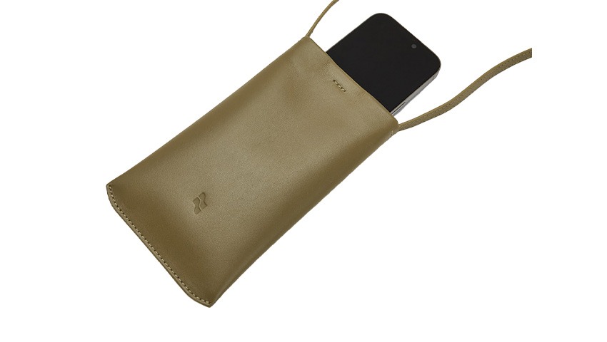brown leather case with phone inside