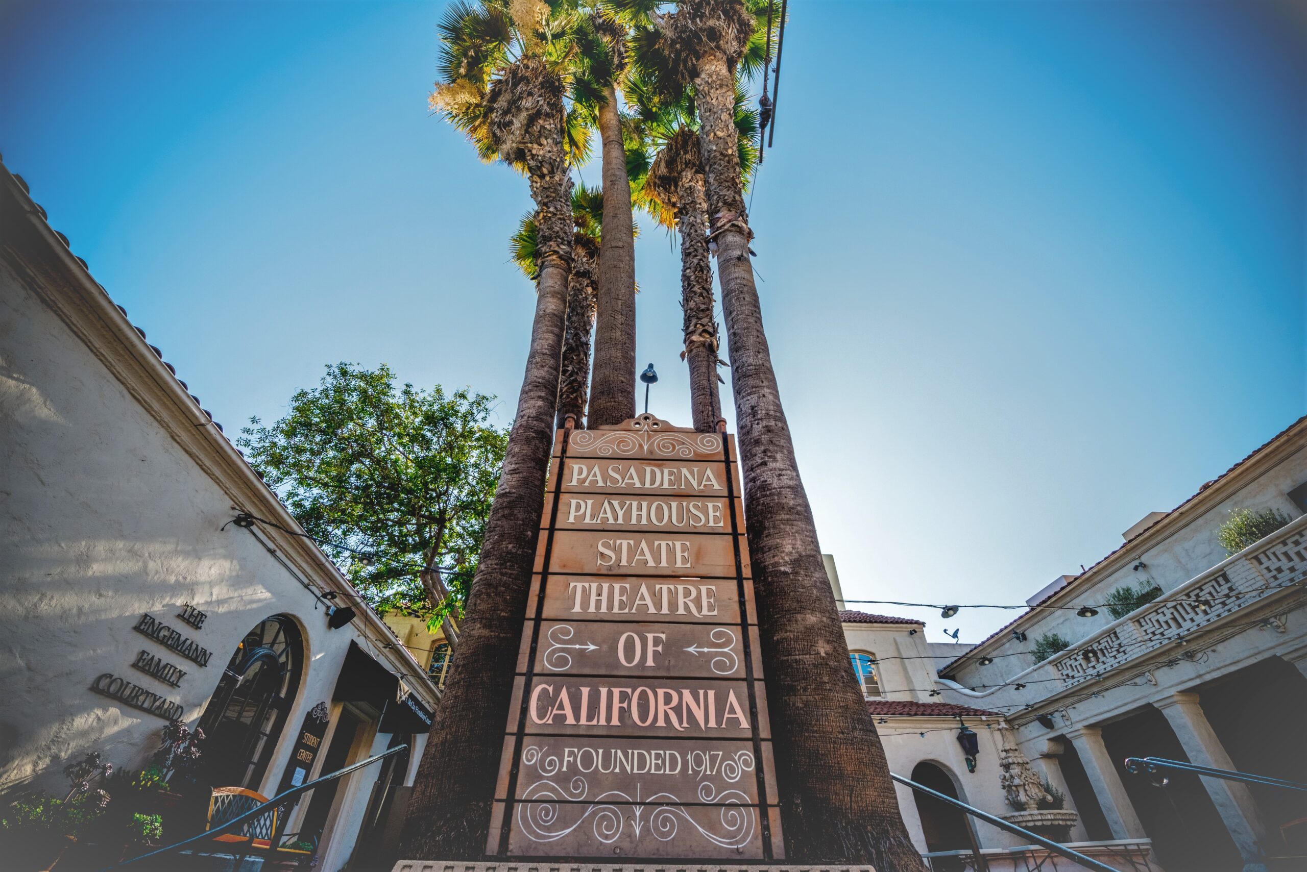 sign that reads "pasadena playhouse state theatre of california, founded 1917" flanked by large building