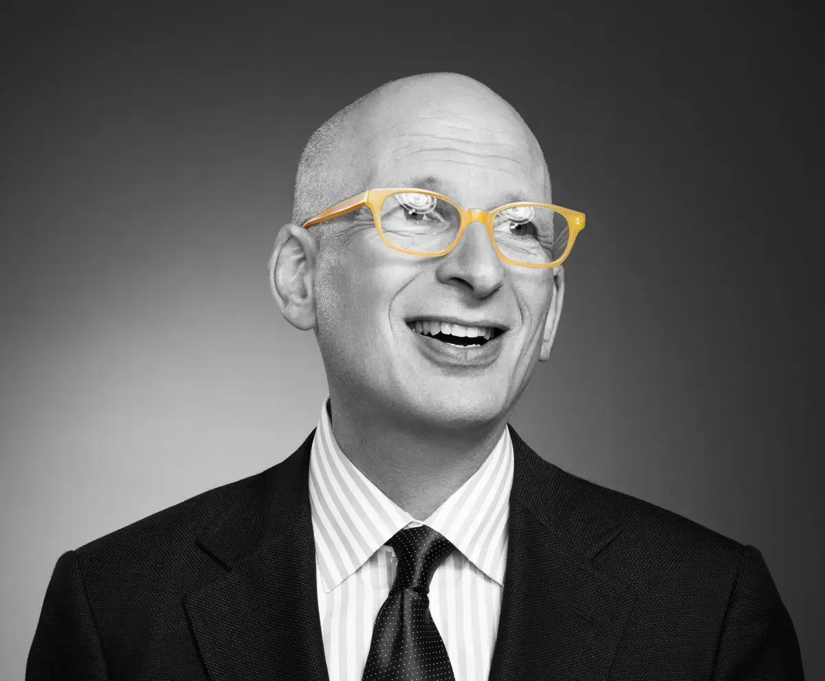 black and white image of man wearing yellow glasses