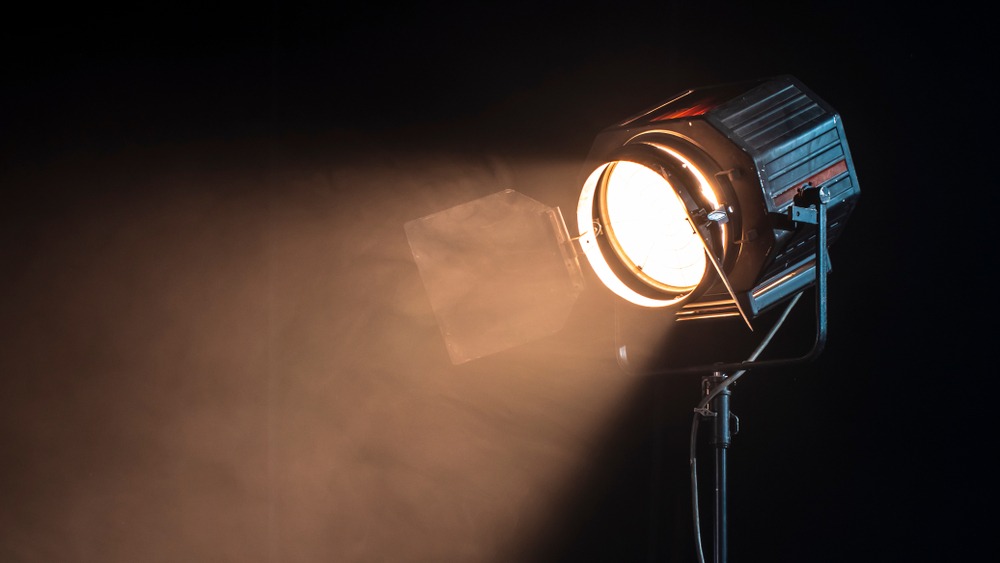 studio light for a movie and TV show on a dark background with smoke