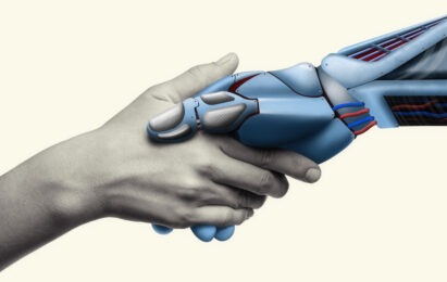 human hand and robot hand holding each other