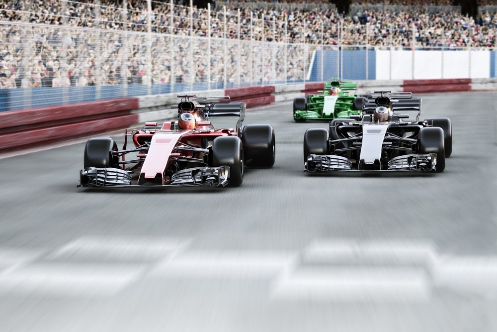 f1 cars racing on track