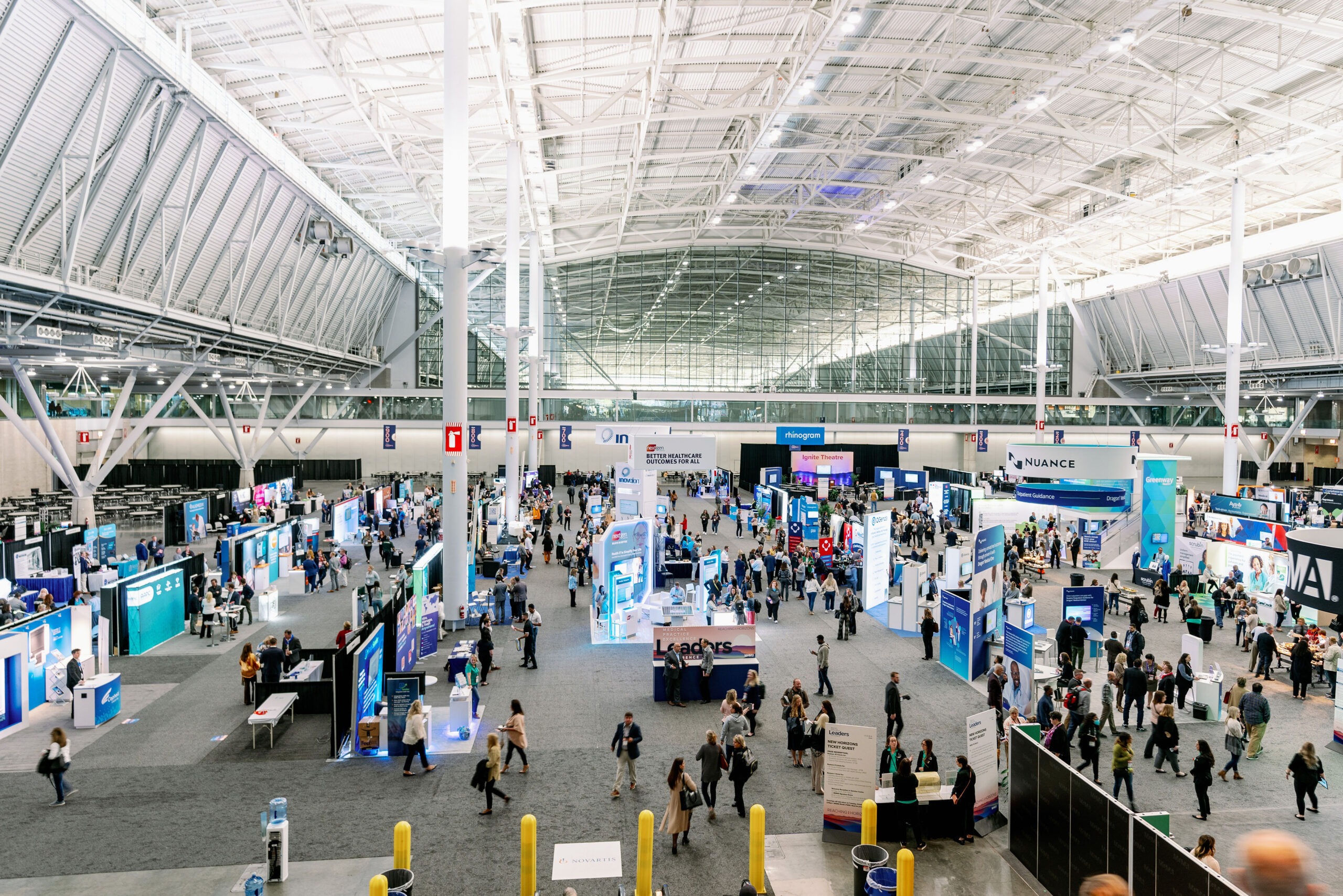 aerial view of exhibit hall full of people