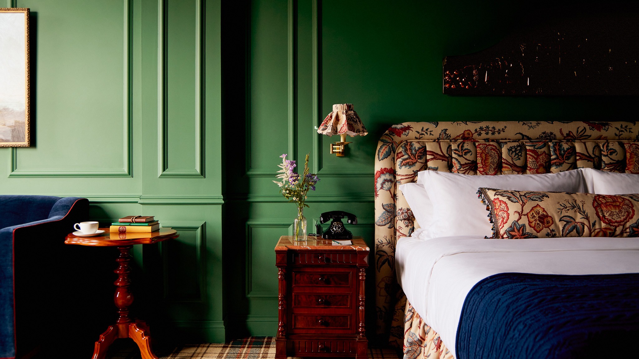 A new and renovated guest room at Slieve Donard with green paneled walls