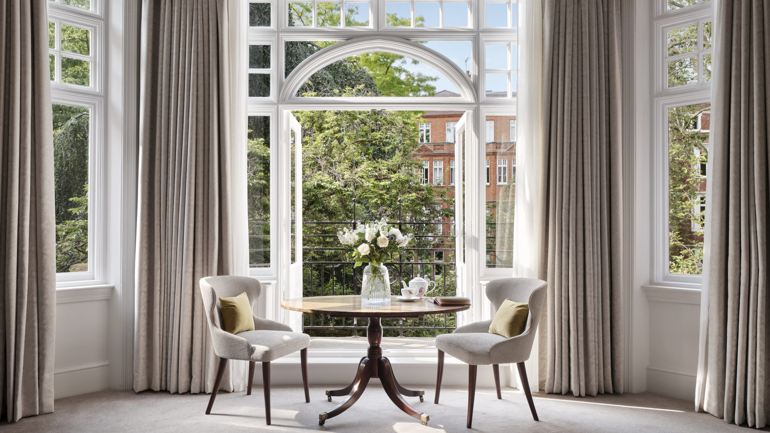 A guest room at The Chelsea townhouse looking out into the garden