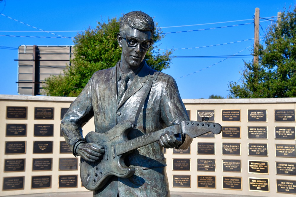 statue of man with guitar